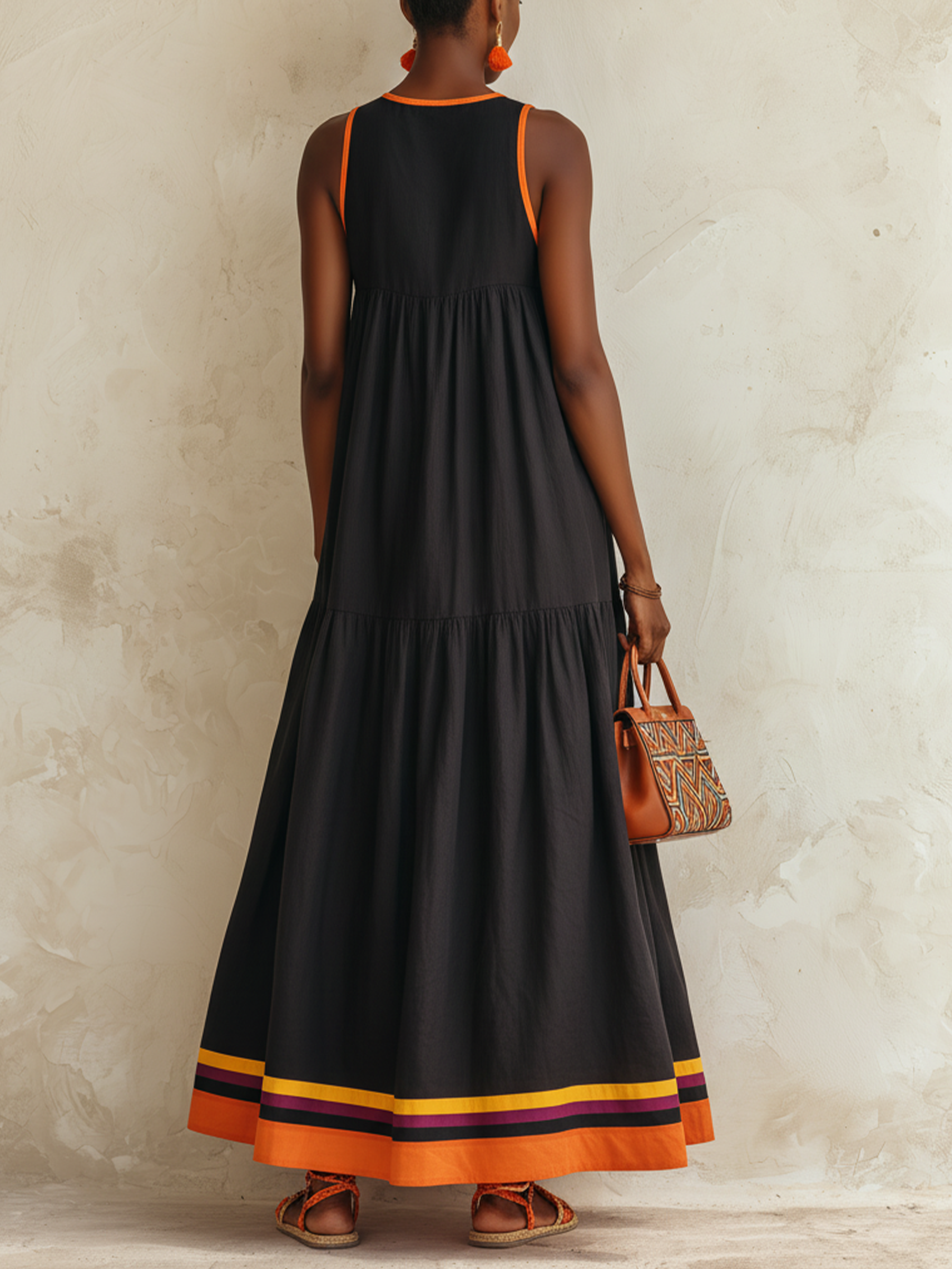 Federica | Abito maxi nero a balze con bordino arancio e orlo multicolor